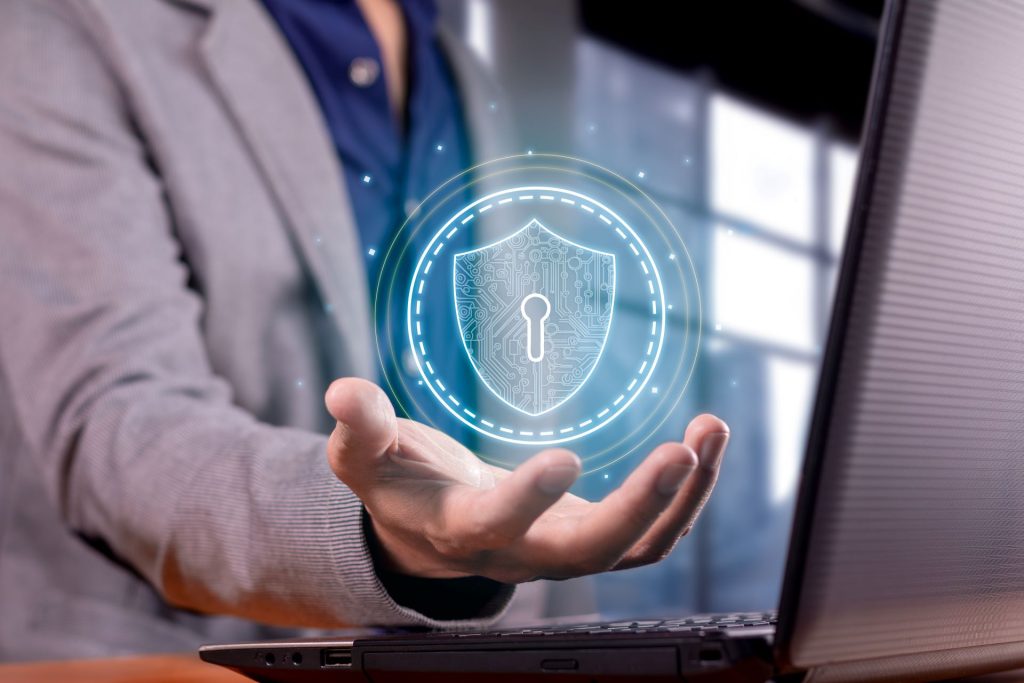 IT security risks, man holding cybersecurity hologram