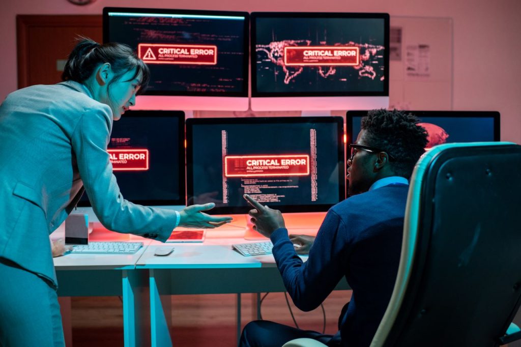 remote work cybersecurity, Two programmers trying to solve problems with access to data